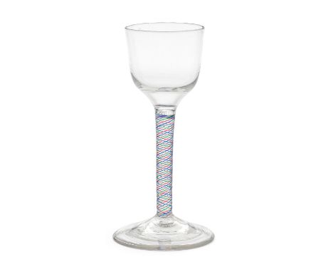 A very rare tartan colour twist wine glass, circa 1765The ogee bowl on a single-series stem comprising four alternating pairs