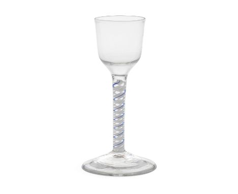 A fine blue colour twist wine glass, circa 1765The ogee bowl on a stem containing a multi-ply corkscrew encircled by one tran