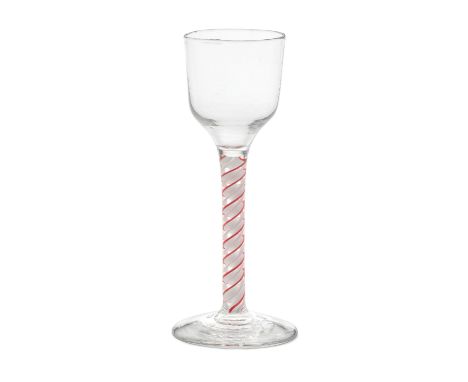 A red colour twist wine glass, circa 1765The ogee bowl on a slender stem containing a well-formed opaque white corkscrew edge