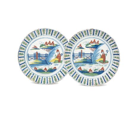 A large pair of Bristol delftware dishes, circa 1720-35Possibly Limekiln Lane, painted in blue, yellow, green and red with Ch