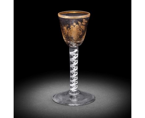 A Giles gilded opaque twist wine glass, circa 1765-70Decorated in the London workshop of James Giles, the round funnel bowl d