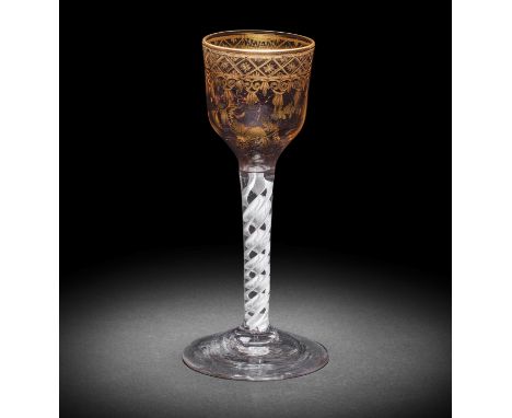 A fine Giles gilded opaque twist wine glass, circa 1765The ogee bowl finely gilded with a so-called 'Grubbe' border of trelli