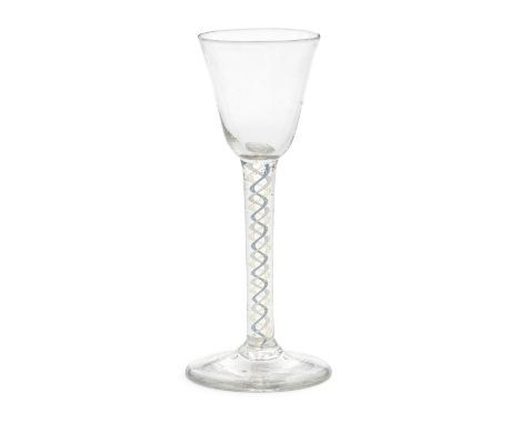 An exceptional yellow and blue colour twist wine glass, circa 1765The round funnel bowl on a single-series stem containing th
