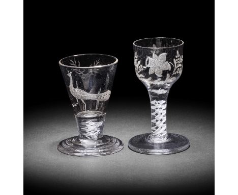 Two engraved opaque twist firing glasses, circa 1765One with an ogee bowl decorated with a daffodil spray, a floral sprig to 