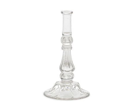 A good moulded stem taperstick, circa 1740The slender cylindrical nozzle set on a beaded knop above a triple collar, the octa
