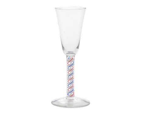 A rare red and blue colour twist ale flute, circa 1765The tall round funnel bowl set on a stem containing a multi-ply corkscr