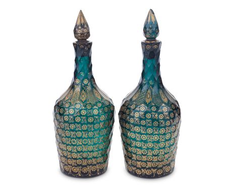 A very rare pair of Giles gilded green glass decanters and stoppers, circa 1765-70Decorated in the London workshop of James G