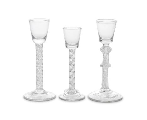 Three airtwist cordial glasses, circa 1750Two with bucket bowls solid at the bases, including one on a double-knopped multi-s