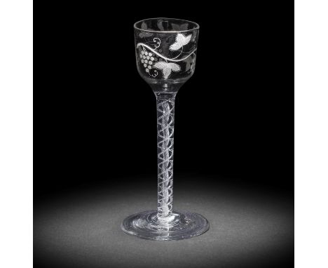 A rare wash-enamelled airtwist wine glass, circa 1760The ogee bowl painted in a thin white enamel with an undulating branch o