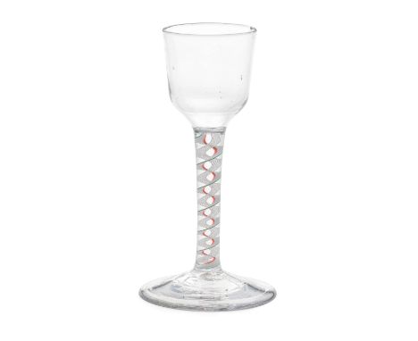 A red and green colour twist wine glass, circa 1765The ogee bowl on a stem containing an opaque white corkscrew edged in tran