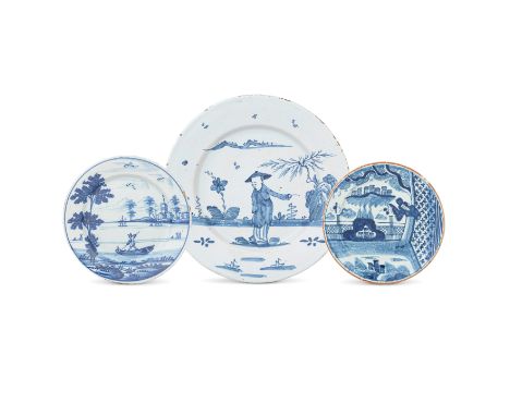 Three English delftware plates, circa 1730-70Comprising a large plate, probably Bristol, painted in blue with an oriental gen
