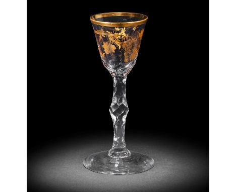 A fine Giles gilded facet stem wine glass, circa 1770Decorated in the London workshop of James Giles, the round funnel bowl d
