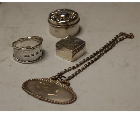 Assorted miniature silver wares to include two pill boxes, napkin ring, decanter collar (4)
