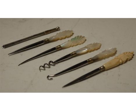Assorted needlework tools to include mother of pearl handled button hook, corkscrew, engine turned silver propelling pencil e