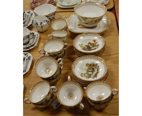 An early Victorian porcelain part tea and coffee service, probably Spode, comprising; pair of cake plates, slop bowl, twelve 