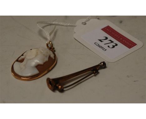 A carved shell cameo brooch and a yellow metal bar brooch in the form of a hunting horn (2)