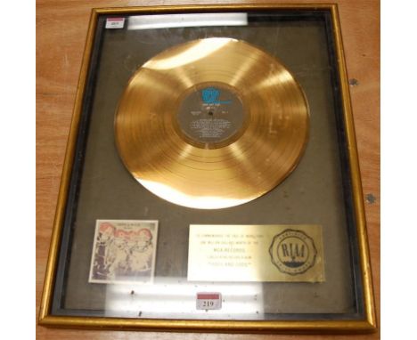 The Who - Odds and Sods commemorative gold disc, housed in display case to commemorate the sale of more than 1 million $ wort