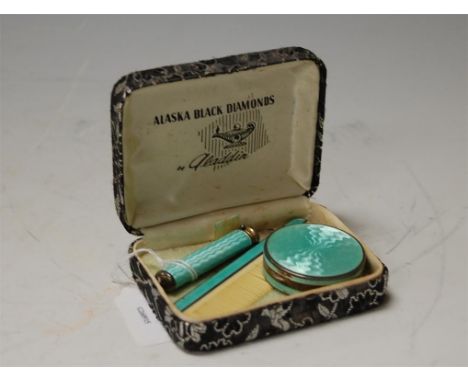 Ladies silver and enamel travelling vanity wares to include powder compact, comb, and lipstick case