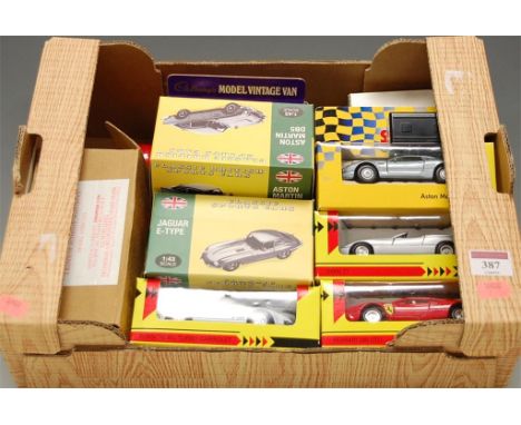 A collection of assorted boxed diecast toy vehicles to include classic sports cars, 1.43 scale model Jaguar E-type