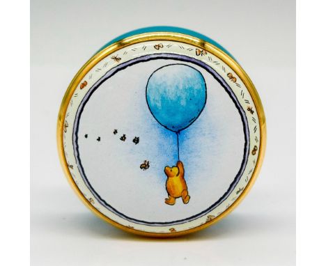 Hand painted enamel box with gilt edge screw top displaying Pooh with balloon. Halcyon Days backstamp. This item has its orig