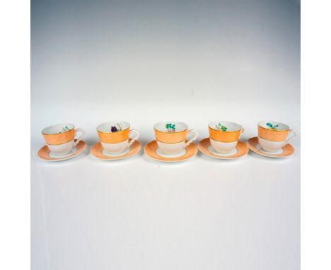A set of five coffee cups with coordinating saucers, featuring charming fruit designs on the inside of the cups and a Salmon 