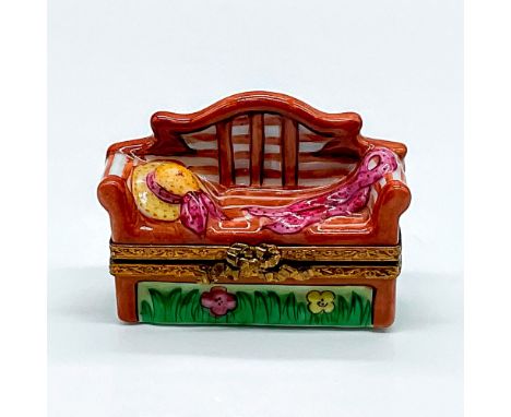 Hand painted box shaped as a wooden bench with a pink ribbon hat and scarf. An open book painted inside the box. Limoges Fran