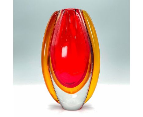 This mouth-blown Art Glass vase is truly a work of art. It's red and orange hues are stunning as the light shines through. Di