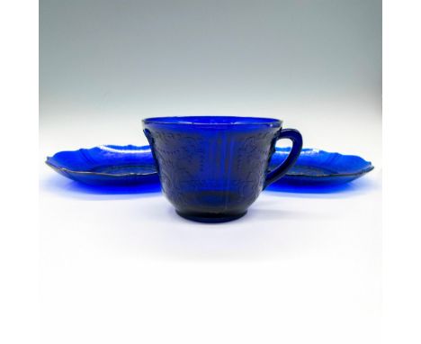 Beautiful, raised floral scrolled design on cup and 2 saucers. Largest piece: 6"L x 6"W x 1"H. Issued: c. 1930-1936Manufactur
