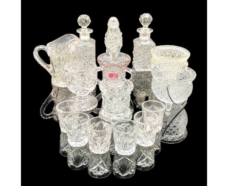 Large collection of pressed patterned glass including two tiny decanter or perfume bottles, small pitcher, six tiny cups, thr