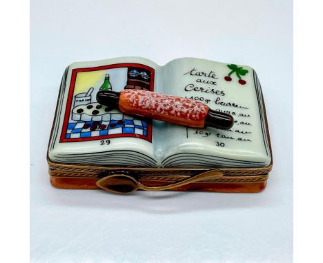 Hand painted box modeled as an open cookbook with a rolling pin on. A rolled up napkin painted inside the box. La Gloriette L