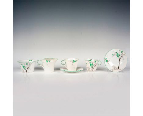 White tea ware set in a white Japanese blossom pattern and green trims. Includes 2 cups with 2 saucers, 1 sugar bowl, and 1 c