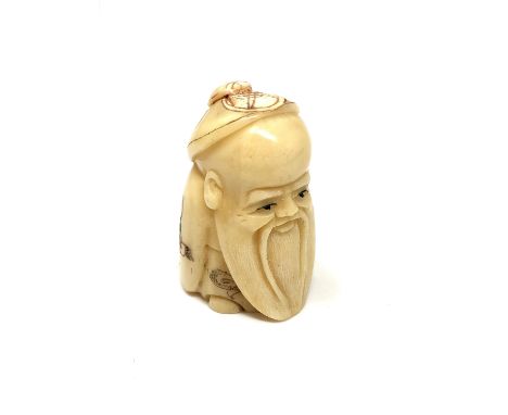 A carved Chinese bone netsuke - Wise man with beard 
