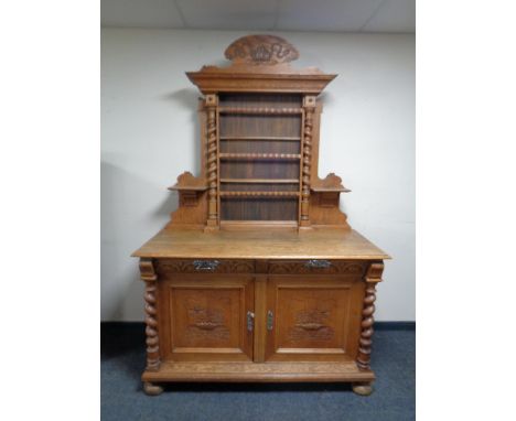 A 19th century oak sideboard with shelf, rack 