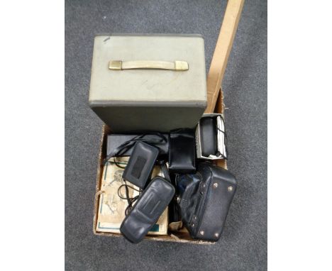 A box containing cameras, projector, etc  