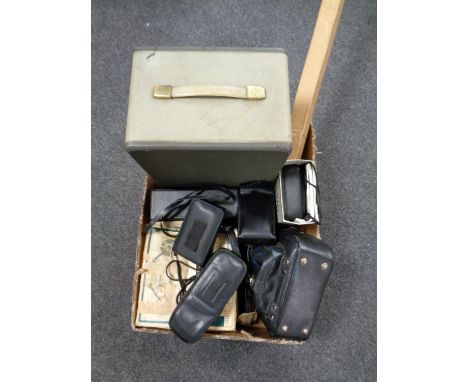 A box containing cameras, projector, etc  