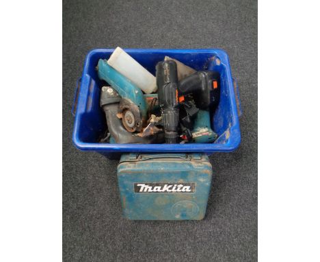 A plastic crate containing various power tools including Makita drill, angle grinder etc   