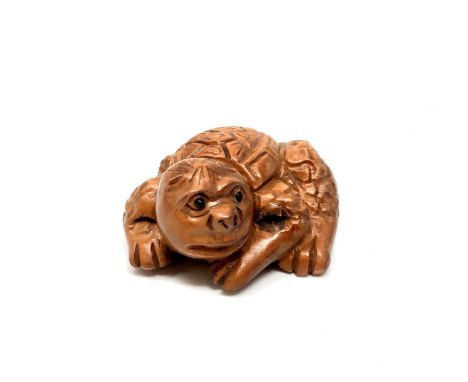 A carved Chinese hardwood netsuke - Mythical sea creature 