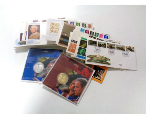 A quantity of first day covers, commemorative coin issues etc  