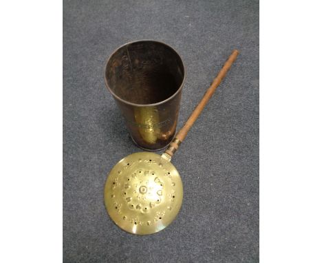 A brass bed warming pan together with a brass stick pot  