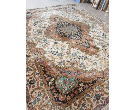 A large Tabriz design carpet, approximately 387 cm x 300 cm