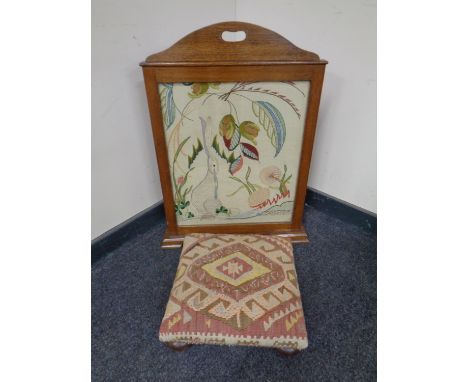 An oak framed tapestry Art Nouveau fire screen decorated with Haires  together with a further tapestry footstool 
