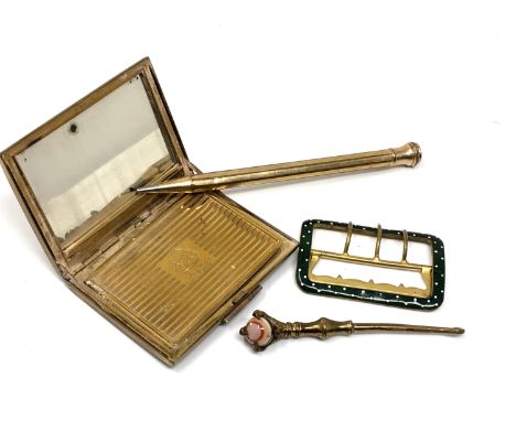 A vintage Stratton compact together with gold plated propelling pencil, button hook and green enamel buckle   