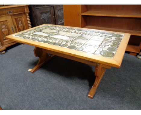 A continental oak coffee table with tile top  