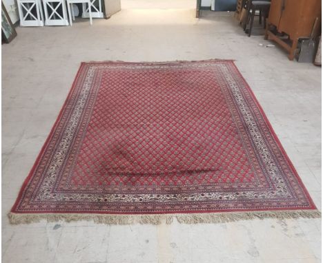 A large Afghan design carpet, approximately 300 cm x 200 cm