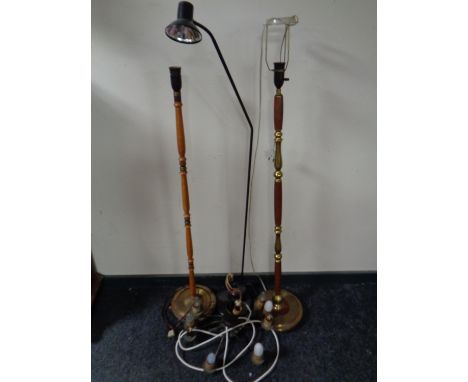 A metal reading lamp together with two further standard lamps and a light fitting 