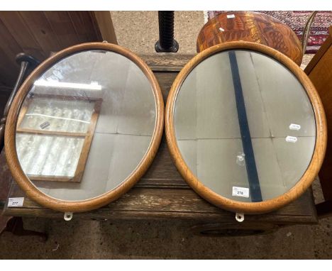 A pair of 20th Century light oak framed oval wall mirrors, 54cm high 