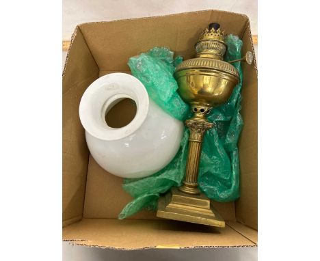Brass based oil lamp with opaque glass shade