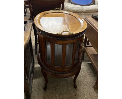 20th Century oval hardwood framed glazed drinks cabinet with lift off tray top