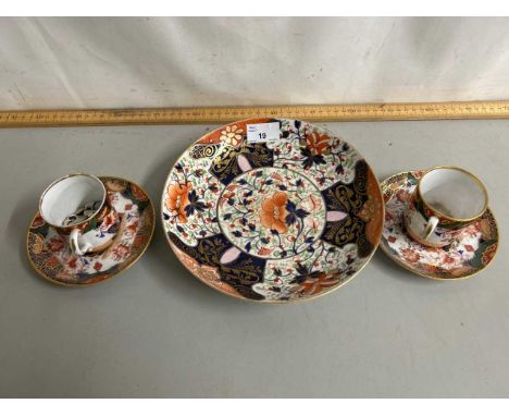 A pair of Spode gilt coffee cans and saucers together with a Crown Derby dish