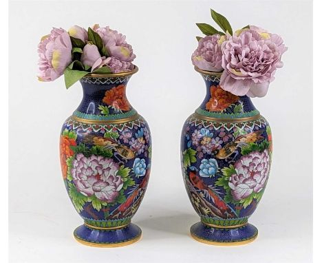 *A pair of Chinese cloisonne enamel vases each decorated with birds amongst chrysanthemums on a blue ground, height 30cm